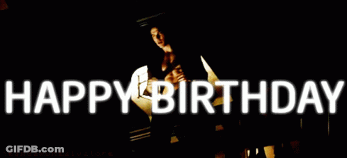 A Man Without A Shirt Is Standing In Front Of A Sign That Says " Happy Birthday " GIF