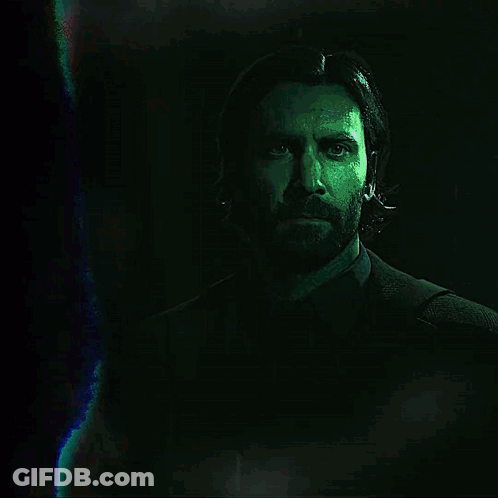 A Man Without A Shirt Is Standing In Front Of A Sign That Says Nightingale GIF