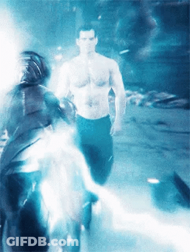 A Man Without A Shirt Is Walking Through A Foggy Room GIF