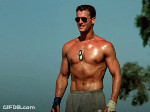A Man Without A Shirt Is Wearing Nike Shorts And Sunglasses GIF