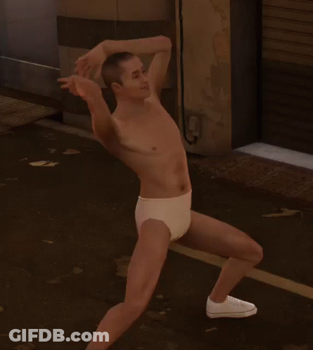A Man Without A Shirt Is Wearing White Underwear And White Shoes GIF