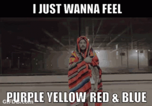 A Man Wrapped In A Blanket With The Words I Just Wanna Feel Purple Yellow Red And Blue GIF