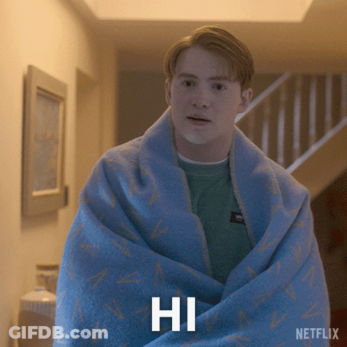 A Man Wrapped In A Blue Blanket With The Word Hi Written On It GIF