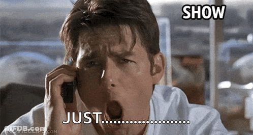 A Man Yawning While Talking On A Cell Phone With A Caption That Says Just Show GIF