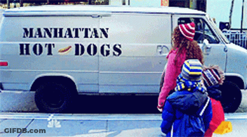 A Manhattan Hot Dog Van Is Parked On The Street GIF