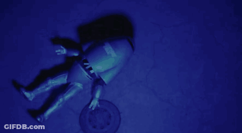 A Manhole Cover With A Sticker On It That Says ' Emergency ' On It GIF