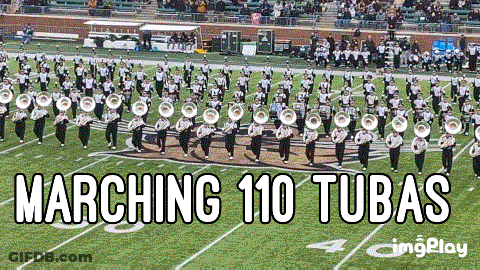 A Marching 110 Tubas Band Is Marching On A Field GIF
