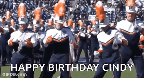 A Marching Band Is Dancing On A Field With The Words Happy Birthday Cindy In The Background . GIF
