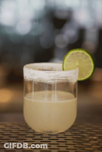 A Margarita In A Glass With A Slice Of Lime On The Rim GIF