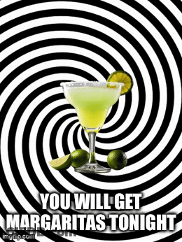 A Margarita In A Glass With Limes On A Black And White Swirl Background . GIF