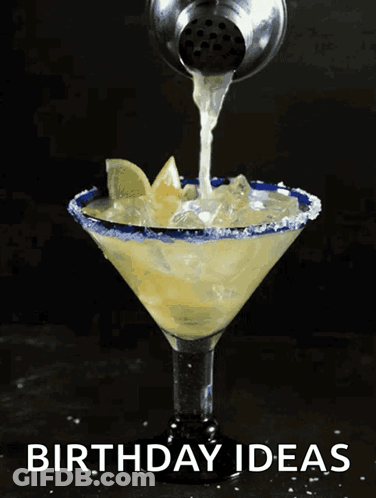 A Margarita Is Being Poured Into A Martini Glass With The Words Birthday Ideas On The Bottom GIF