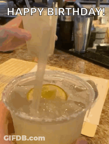 A Margarita Is Being Poured Into A Plastic Cup With The Words Happy Birthday Written On The Bottom GIF