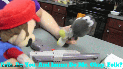 A Mario Mascot Is Holding A Nintendo Game Controller GIF
