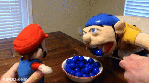 A Mario Puppet Is Being Fed Blue Balls By A Jeff Puppet GIF