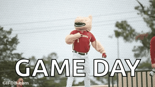 A Mascot For The Alabama Baseball Team Is Standing On A Baseball Field GIF