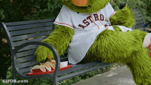 A Mascot For The Astros Sits On A Bench GIF