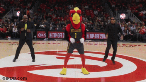 A Mascot For The Atlanta Hawks Dancing On The Court GIF