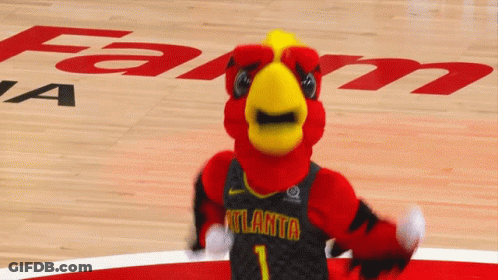 A Mascot For The Atlanta Hawks Stands On The Court GIF