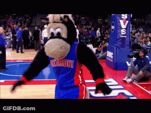 A Mascot For The Detroit Pistons Is Dancing On The Court GIF