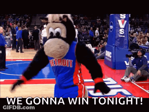 A Mascot For The Detroit Pistons Is Dancing On The Court GIF