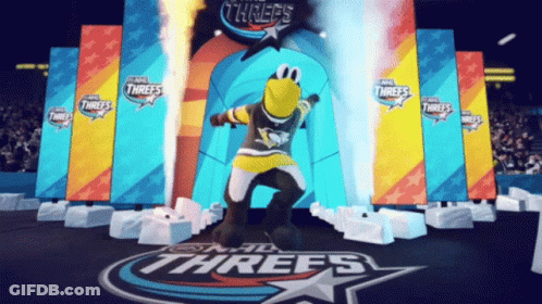 A Mascot For The Nhl Threes Is Dancing In Front Of A Stage GIF