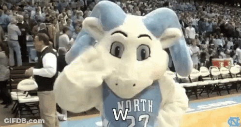 A Mascot For The North Carolina Rams Is Standing On A Basketball Court GIF