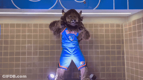 A Mascot For The Oklahoma City Thunder Stands In A Bathroom GIF