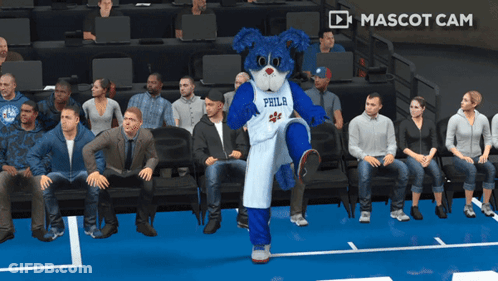 A Mascot For The Philadelphia 76Ers Is Standing On The Court GIF