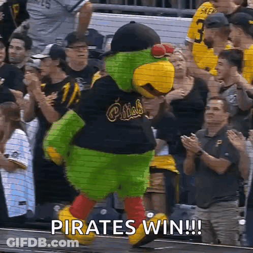 A Mascot For The Pirates Is Dancing In Front Of A Crowd At A Baseball Game GIF