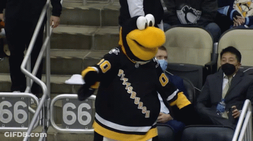 A Mascot For The Pittsburgh Penguins Stands In The Stands GIF