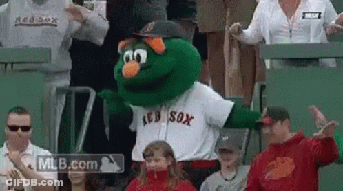 A Mascot For The Red Sox Is Dancing In The Stands . GIF