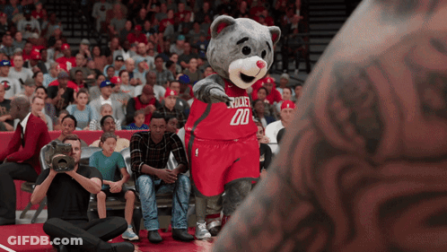 A Mascot For The Rockets Wears A Red Jersey With The Number 20 On It GIF