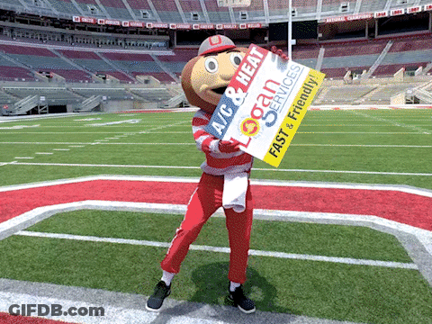 A Mascot Holding A Sign That Says " Logan Services " GIF
