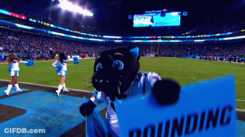 A Mascot Holding A Sign That Says Pounding On It GIF