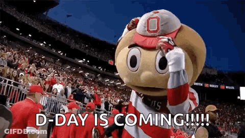 A Mascot In A Stadium With The Words `` D-Day Is Coming '' Written On It . GIF