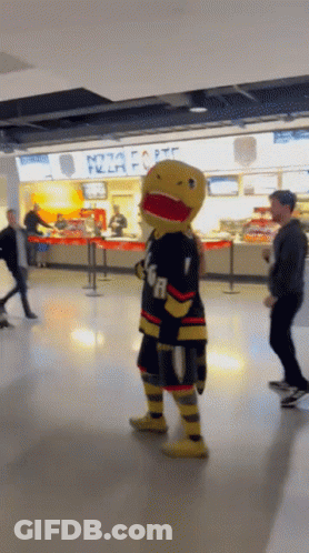 A Mascot In Front Of A Pizza Hut GIF