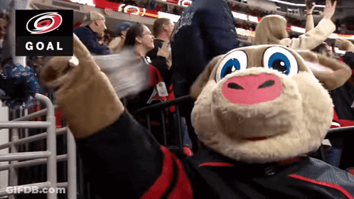 A Mascot In Front Of A Sign That Says Goal On It GIF