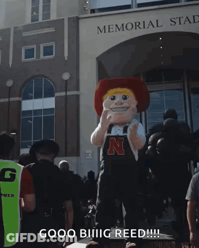 A Mascot In Front Of The Memorial Stadium Says Good Biiiig Reed GIF