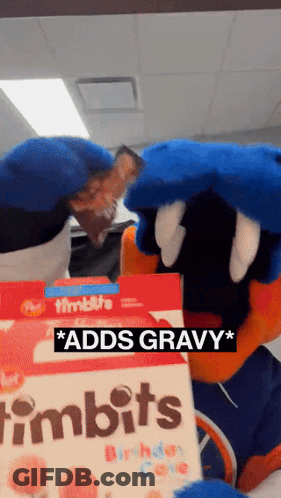 A Mascot Is Holding A Box Of Timbits Birthday Cake GIF