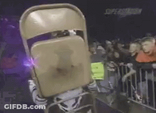 A Mascot Is Holding A Chair In Front Of His Face GIF