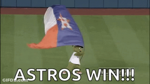 A Mascot Is Holding A Texas Flag On A Baseball Field And Says `` Astros Win '' . GIF