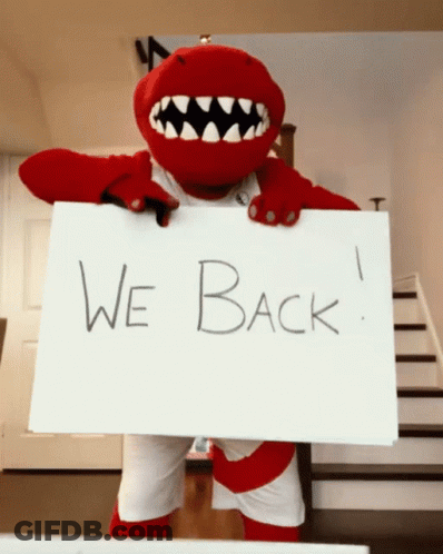 A Mascot Is Holding Up A Sign That Says We Back GIF