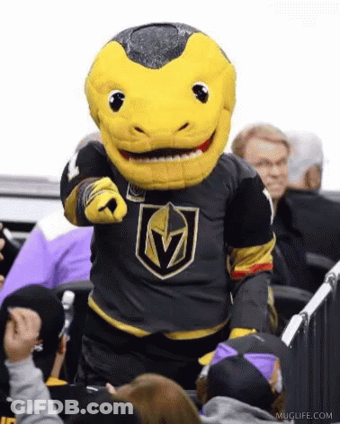 A Mascot Is Pointing At The Camera While Standing In Front Of A Crowd . GIF