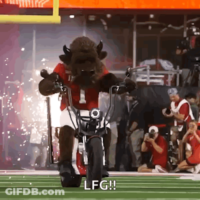 A Mascot Is Riding A Motorcycle On A Field And Says Lfg GIF