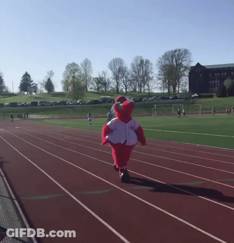 A Mascot Is Running On A Track Wearing A White Jersey GIF