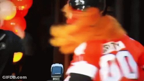 A Mascot Is Wearing A Red Jersey With The Number 60 On It GIF