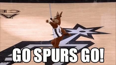 A Mascot On A Basketball Court With The Words Go Spurs Go On The Bottom . GIF