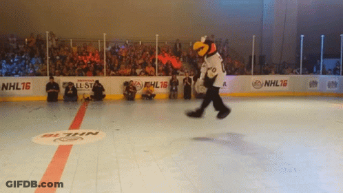 A Mascot On A Hockey Rink That Says Nhl16 On The Side GIF