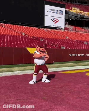 A Mascot Stands On A Football Field In Front Of A United Airlines Sign GIF