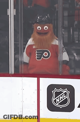 A Mascot Wearing A Flyers Jersey Looks Out Of A Window GIF